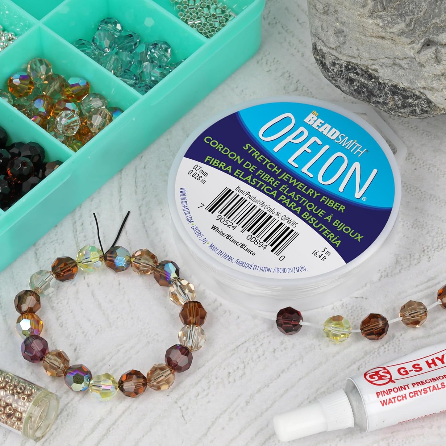 The Beadsmith Opelon Stretch Cord – Elastic Beading Fiber, White, 0.7 mm Diameter, 5 Meters (16.4 ft) Spool